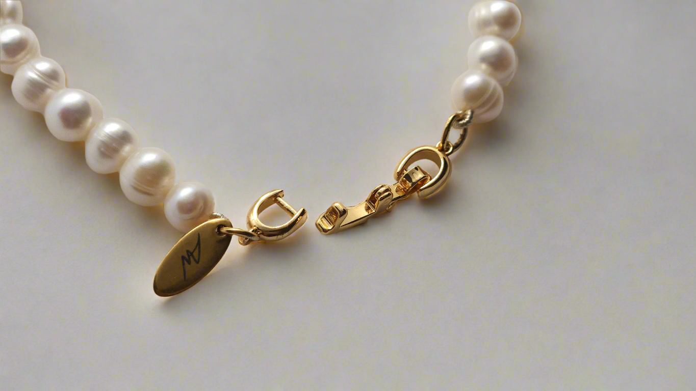 White Pearl Bracelet - gold fold-over clasp