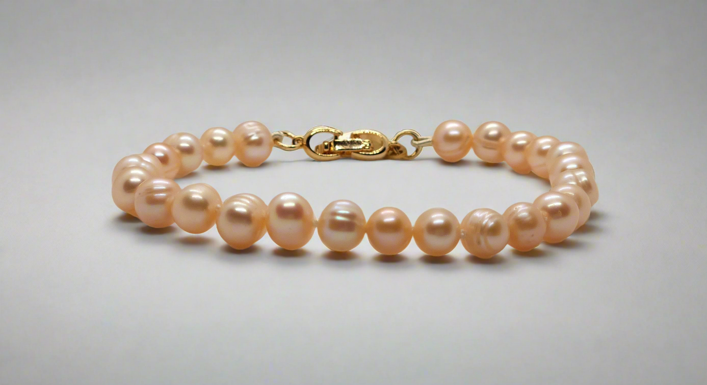 Peach Pearl Bracelet - gold fold-over clasp