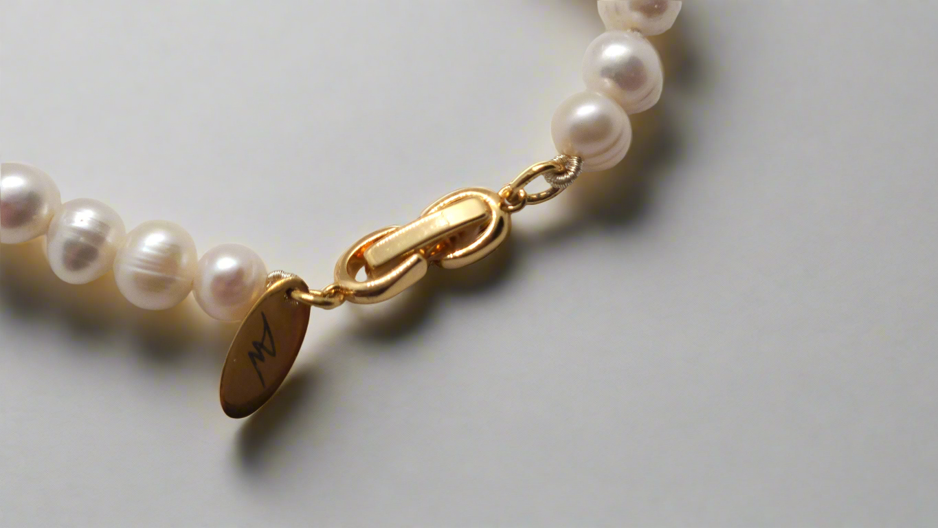 White Pearl Bracelet - gold fold-over clasp
