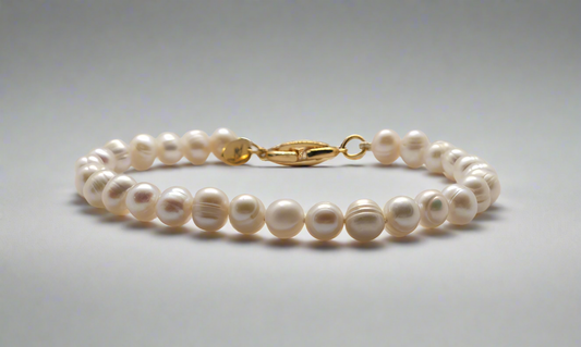 White Pearl Bracelet - gold fold-over clasp
