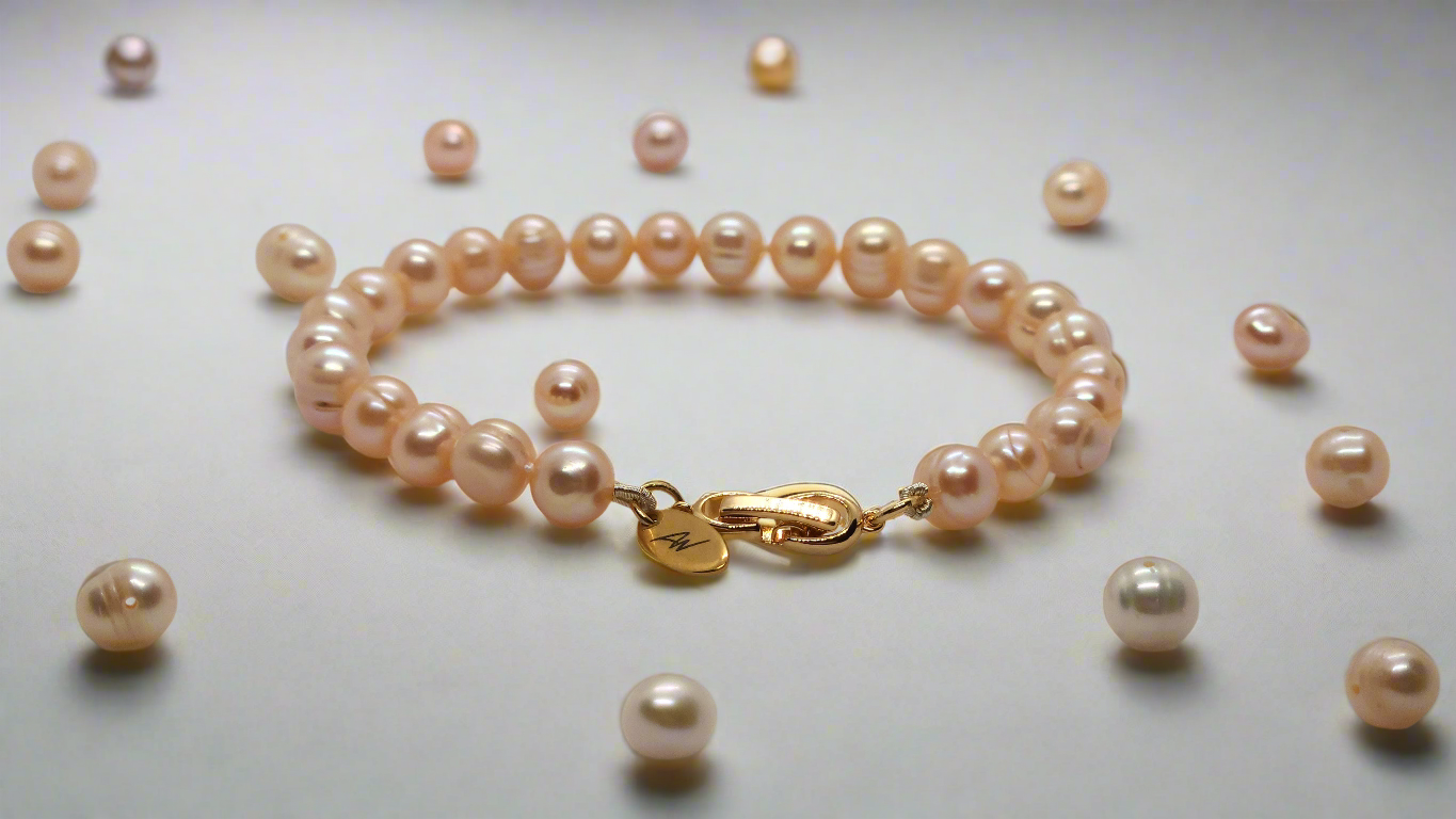 Peach Pearl Bracelet - gold fold-over clasp